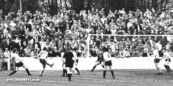 Noel Ashford shoots for goal in front of the Gas Works End versus Slough Town
