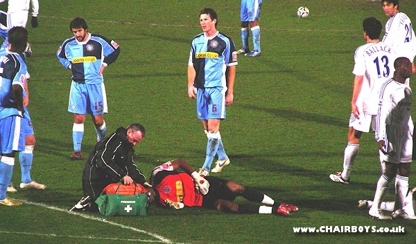 Ricardo Batista lays pole-axed after clashing heads with Wayne Bridge as the Chelsea player had given the visitors the lead - picture Paul Lewis