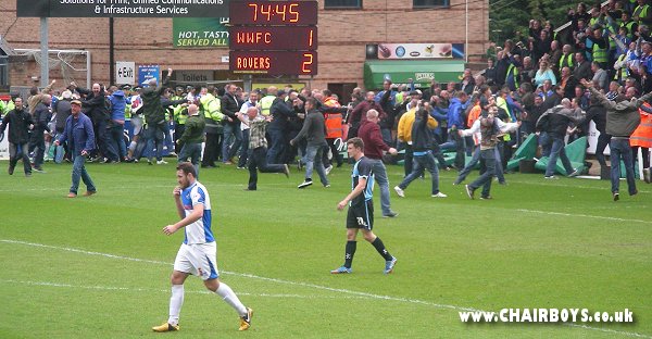 Rovers fans celebrate the goal that looked to have saved them from the drop while condeming Wycombe to Conference football