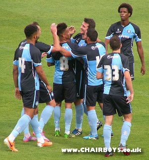 Wanderers players congratulate Pete Murphy after his goal against Barnet