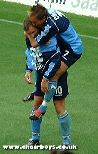 Sean Devine and Darren Currie celebrate Wycombe's opening goal