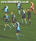 Wycombe players celebrate at Brisbane Road