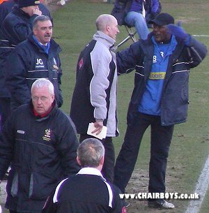 Wycombe bench not happy with the red card shown to Kevin Betsy