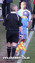 Jermaine Easter expresses his opinion to the Assistant Linesman after Kevin Betsy's red card