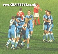 Wycombe players celebrate after Easton bags the extra-time winner