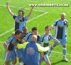 Celebrations after Roger Johnson had put Wycombe into the lead