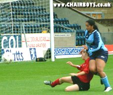 Jasmine Brown under challenge from a Clapton defender