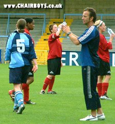 Wanderers boss Graham Malcolm looks on during a drinks break