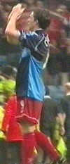 Fowler applauds the Wycombe fans in a Jason Cousins shirt - surreal